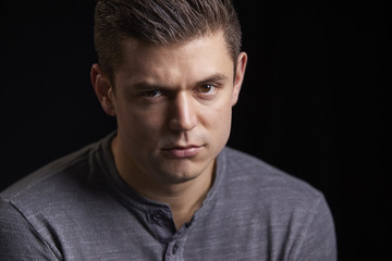 Fototapeta premium Portrait of a worried young white man looking to camera
