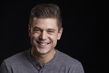 Portrait of a smiling young white man looking to camera