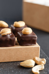 Handmade chocolate bonbons with cashew