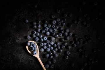 blueberries and wooden spoon