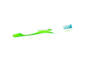 White and green plastic toothbrush