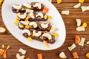 Chocolate bars with cashew and candied fruits