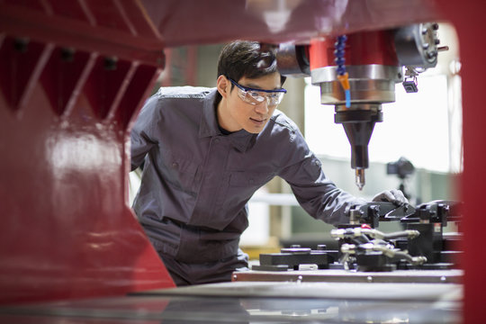 Young engineer working in the factory