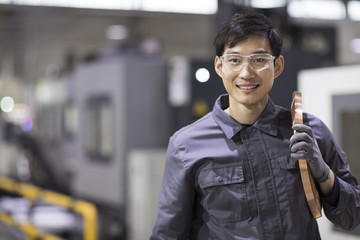 Confident engineer in the factory