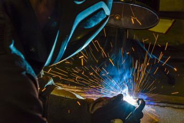 Industrial steel welder in factory