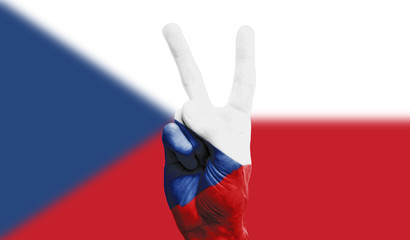 Czech Republic national flag painted onto a male hand showing a victory, peace, strength sign
