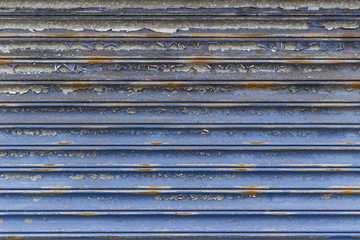 Flaked paint mettal shop shutter closed