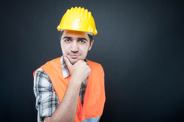 Portrait of constructor posing with hand on chin