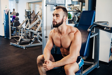 Fototapeta premium Muscular guy in the gym