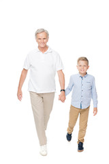 grandfather with grandchild holding hands