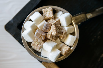 Lumps of white and brown sugar in restaurant
