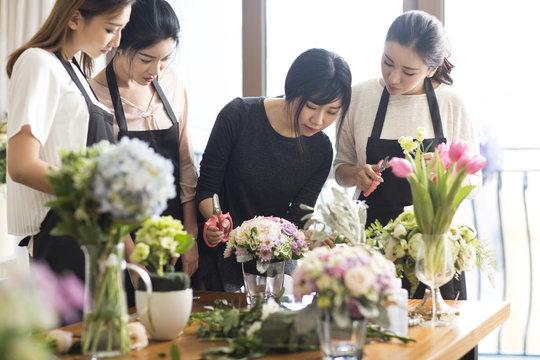 Young Women Learning Flower Arrangement