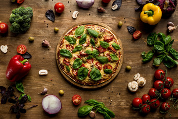 Fototapeta na wymiar pizza with fresh herbs