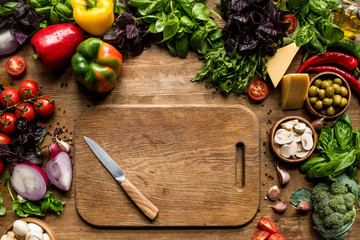cutting board, vegetables and herbs