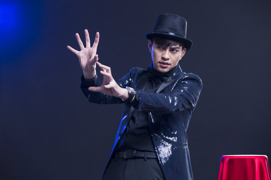 Young magician performing magic trick