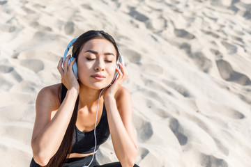 asian woman listening music