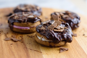 Cinnamon and marshmallow sandwich cookies topped by chocolate