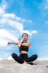 sportswoman stretching hands