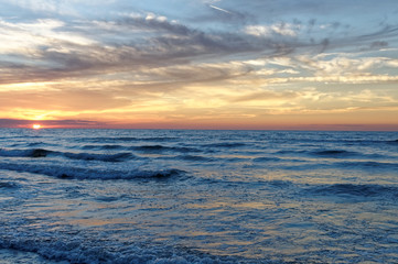 Fototapeta na wymiar Sunset over sea. Colorful sky and waves at sea. Poland, Jastrzebia Gora