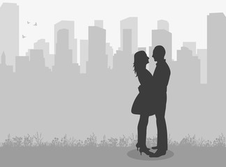  silhouette of a guy and a girl, love on a city background
