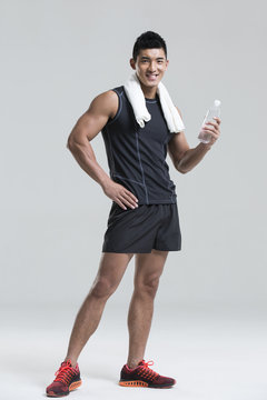 Male athlete with a bottle of water