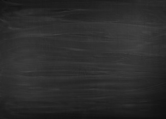 Fototapeta premium Blackboard / chalkboard texture. Empty blank black chalkboard with chalk traces.