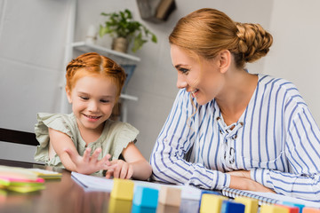 mother and daughter learning math at home