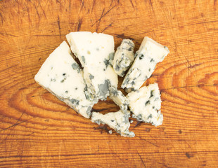 Cheese with Mold on Rustic Background