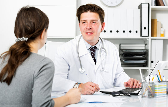 Doctor with patient sitting at the table