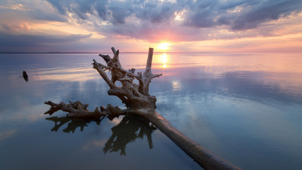 sunrise on the water / Early summer morning bright sky Beach