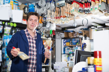 Male selling brushes for repair