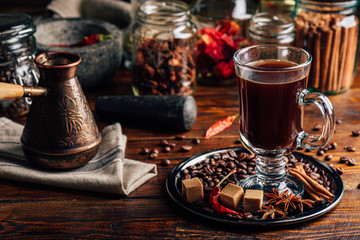 Cezve and Cup of Coffee on Plate with Oriental Spices.