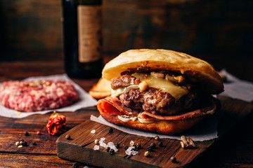 Homemade Burger on Cutting Board.