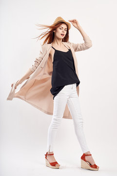 Young beautiful woman in a hat on white isolated background, fashion, style, beauty