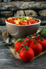 Tomato soup with meatballs in a bowl. Italian minestrone soup