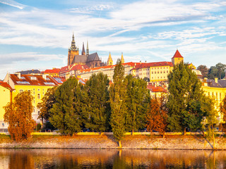 Fototapeta premium Sunny colorful morning in Prague. View of Prague Castle from Vltava river, Czech Republic.