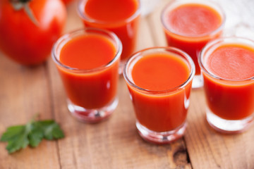 Cold Bloody Mary cocktail shot in glasses 