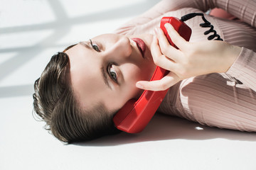 stylish girl with vintage telephone