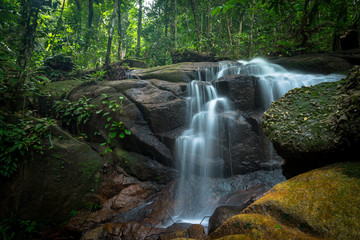 Fototapeta premium Small and safe water flows, cool air and green scenery are attractions that you can enjoy when you visit Ampang waterfall in Selangor, Malaysia