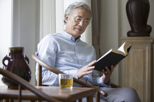 Senior man reading a book