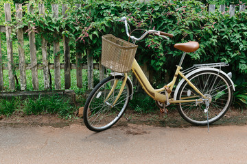 Fototapeta na wymiar bicycle on a wooden fence background