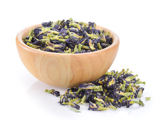 dry Pea flowers in wood spoon on white background
