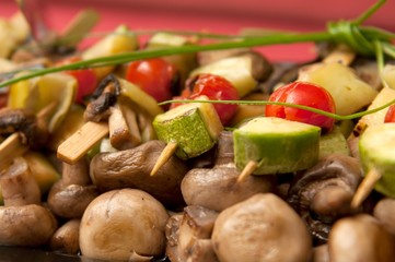 Cooked vegetables and mushrooms served on a plate