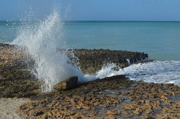 Large Wave Shooting Through a Crack in the Lava Rock