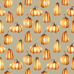 Seamless pattern with watercolor pumpkins, hand painted isolated on a brown background