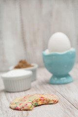 Obraz na płótnie Canvas Confetti Cookie Bitten With Egg and Sugars