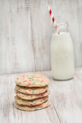 Stack of Colorful Confetti Cookies With Milk