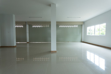 empty room in house residential building with aluminium roller shutter door and window glass