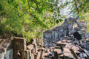 Prasat Beng Mealea in Angkor Complex, Siem Reap, Cambodia. It is largely unrestored, old trees and brush growing amidst towers and many of its stones lying in great heaps. Ancient Khmer architecture.
