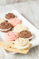 Vanilla Strawberry and Chocolate Cookies On Platter With Spatula